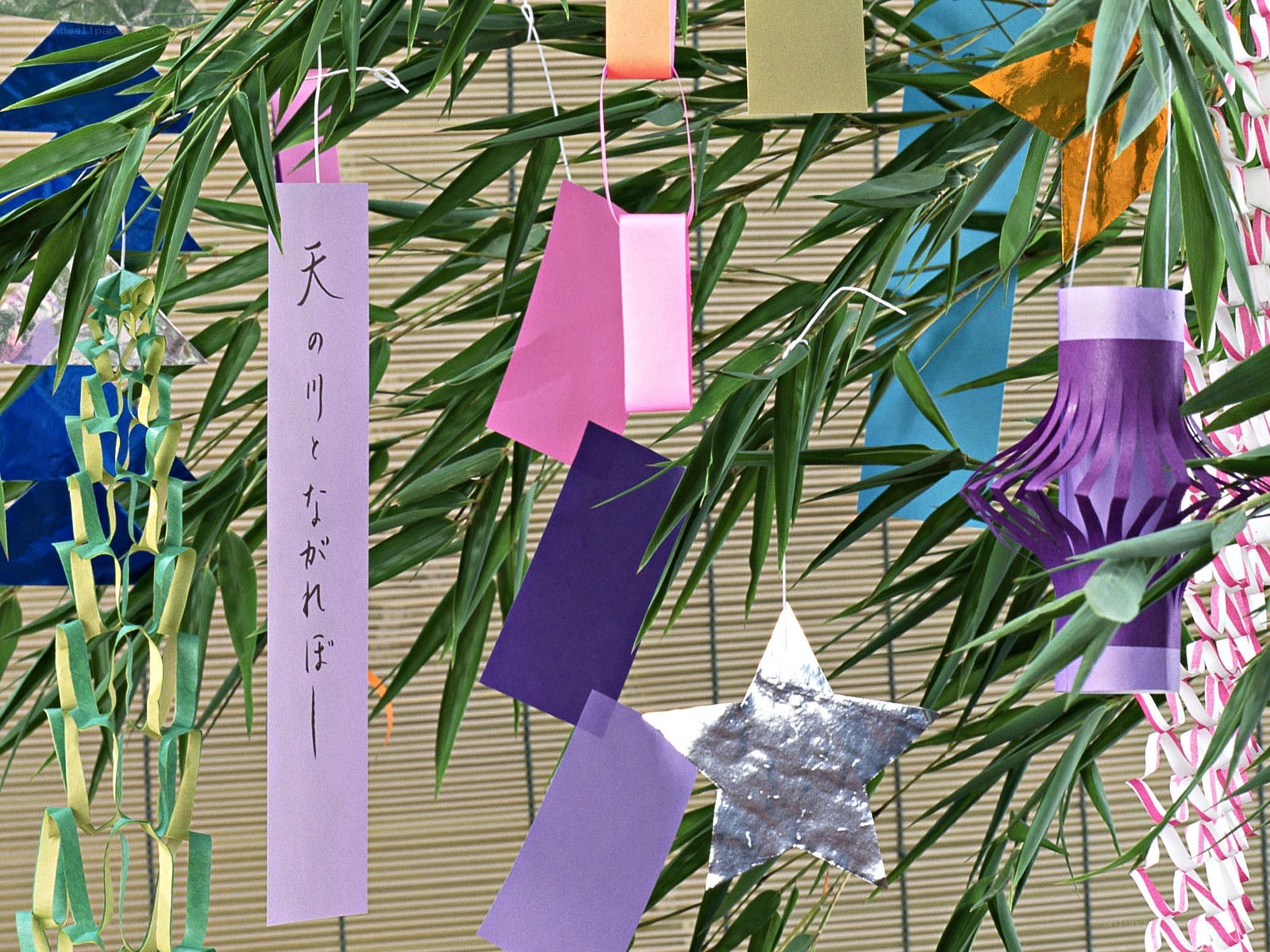 Colorful paper decorations on bamboo