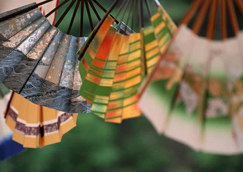 Colorful paper fans hanging
