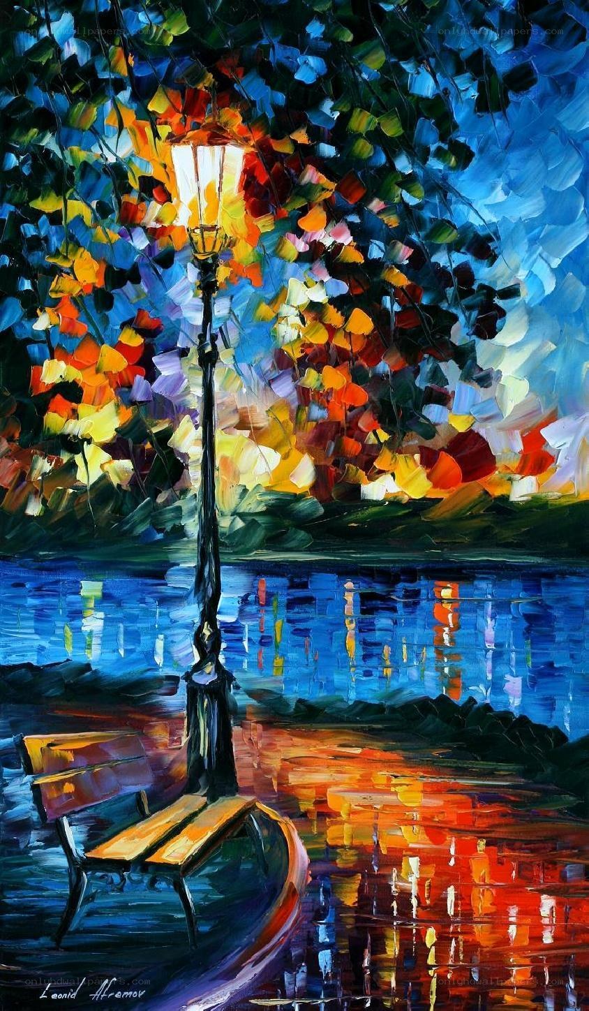 Colorful park bench by water
