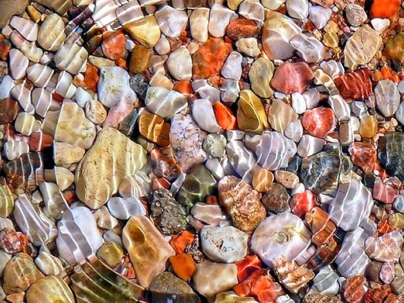 Colorful pebbles under water