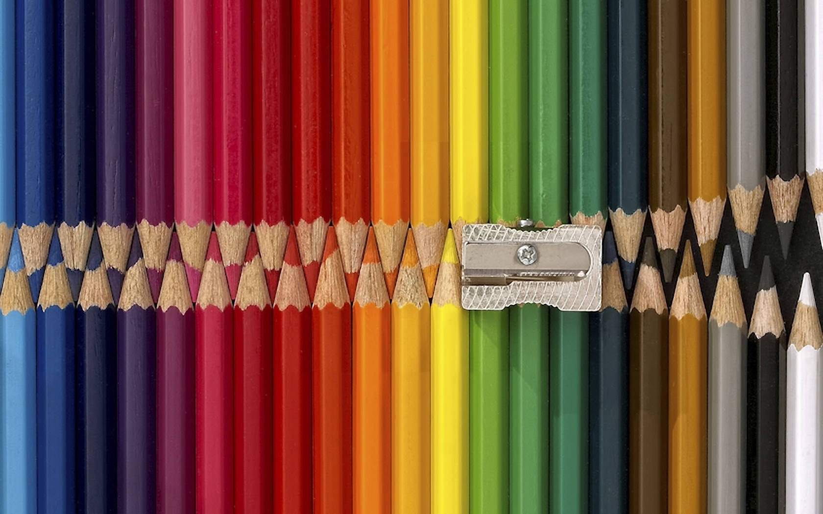 Colorful pencils and sharpener
