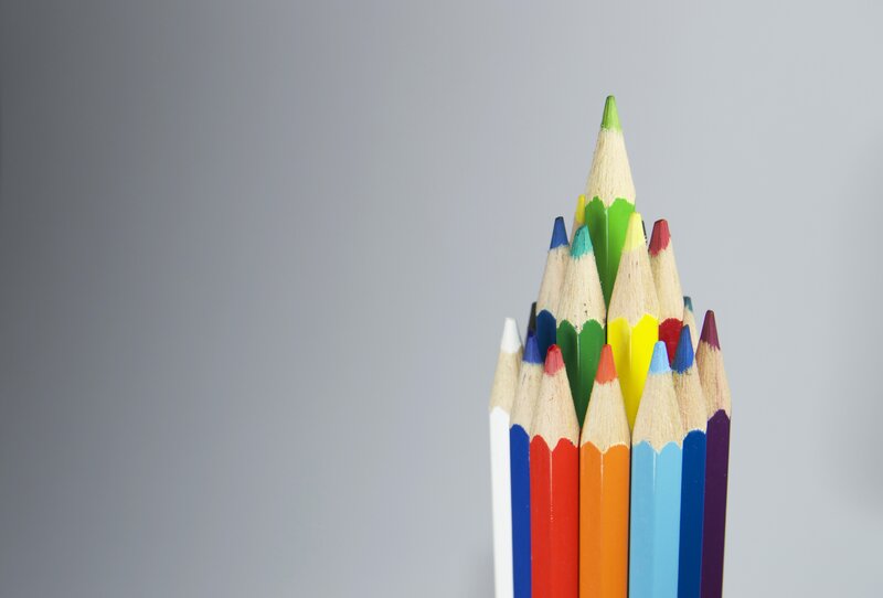 Colorful pencils arranged in a pyramid