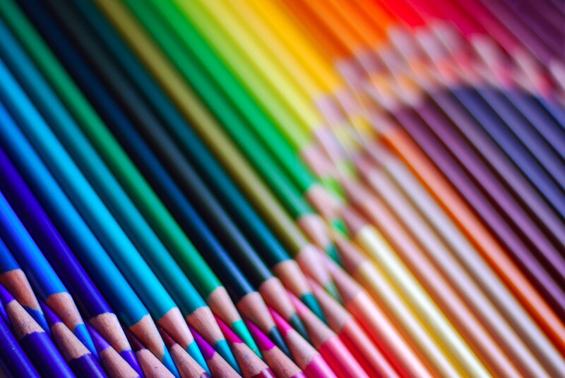 Colorful pencils arranged in rainbow