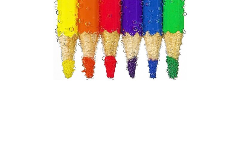 colorful pencils in water