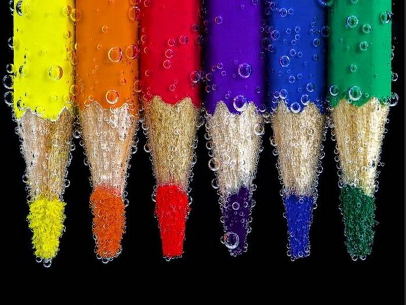 Colorful pencils in water