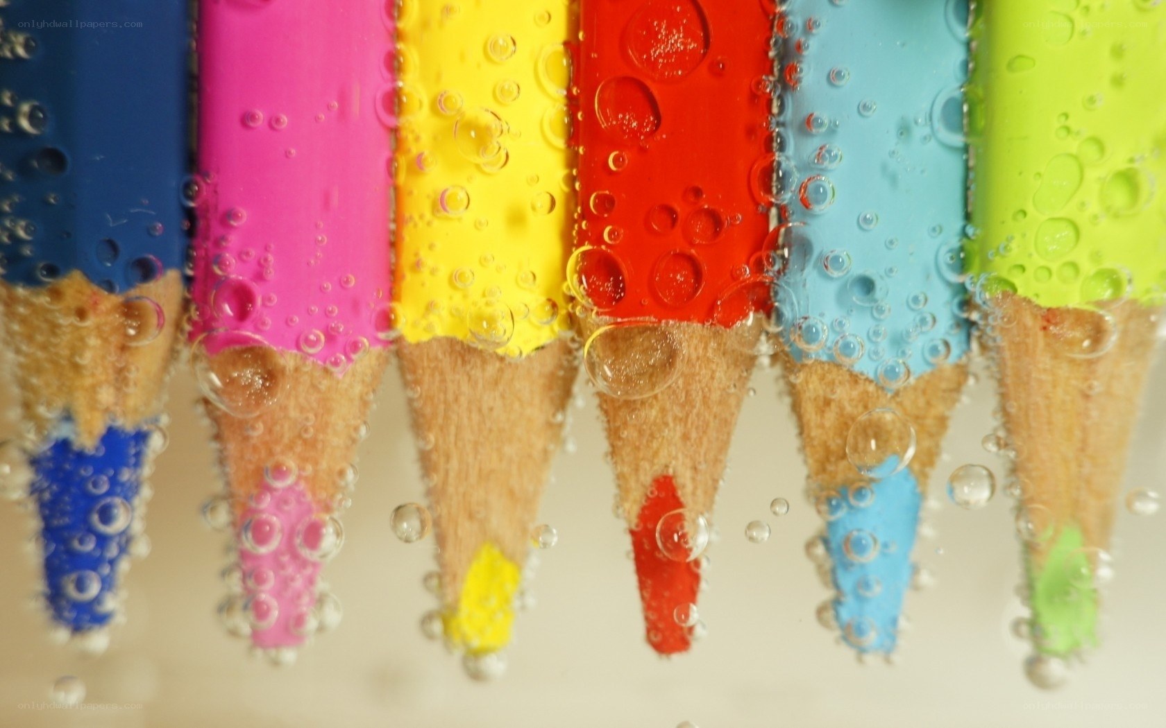 Colorful pencils in water