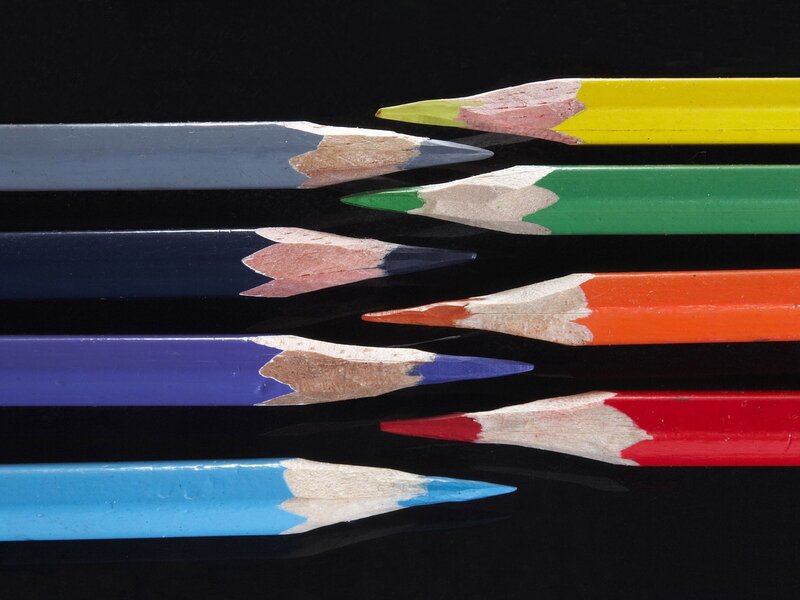 Colorful pencils on black