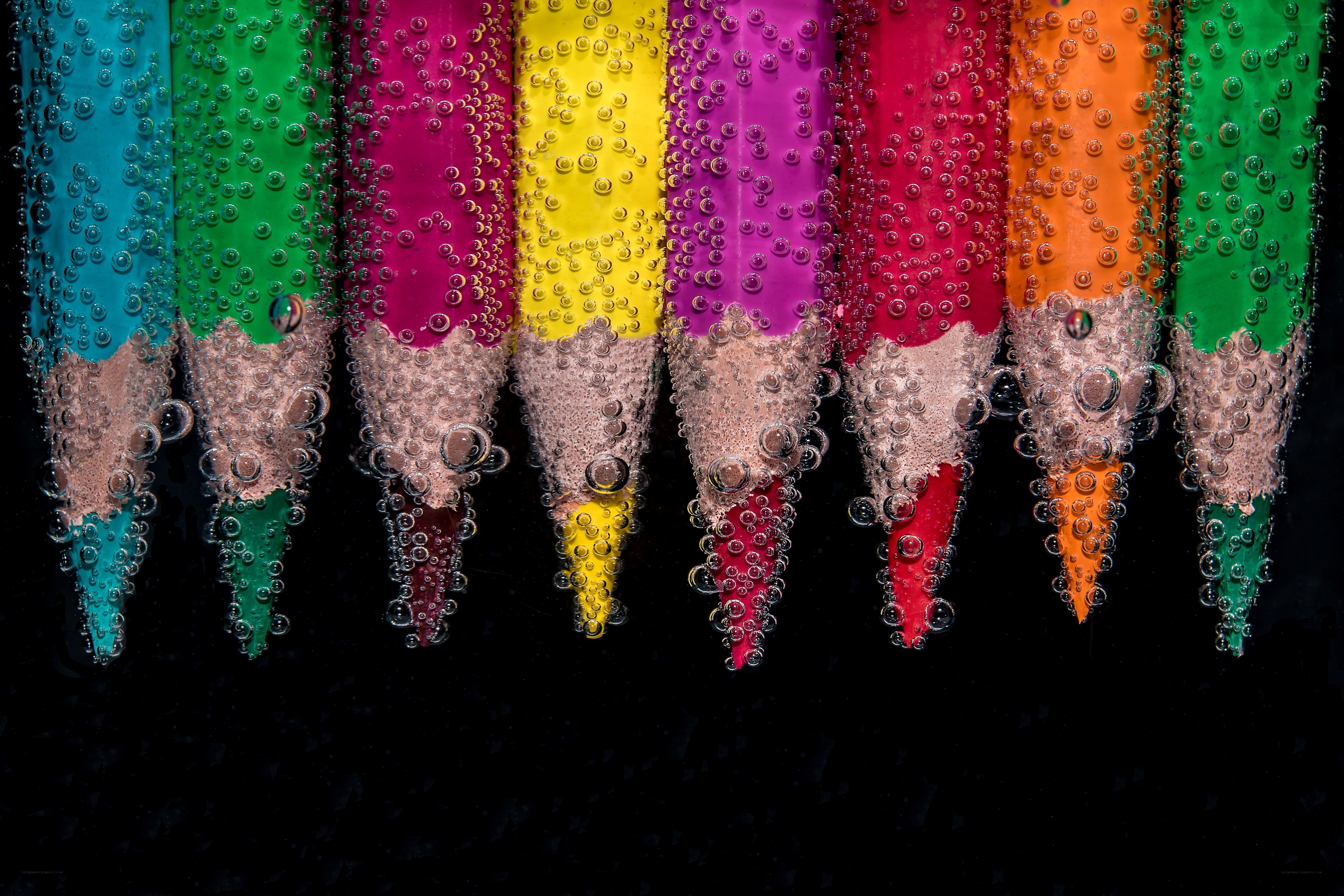 Colorful pencils underwater
