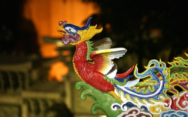 colorful phoenix sculpture at night