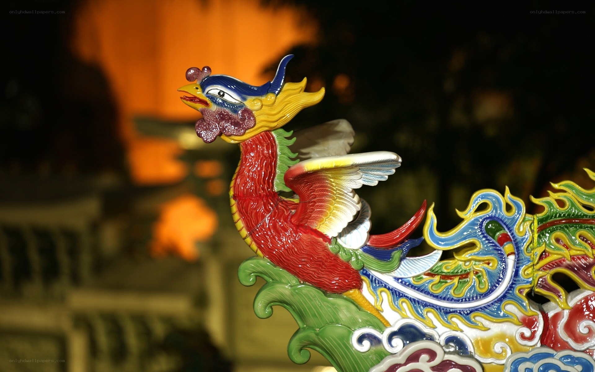 colorful phoenix sculpture at night