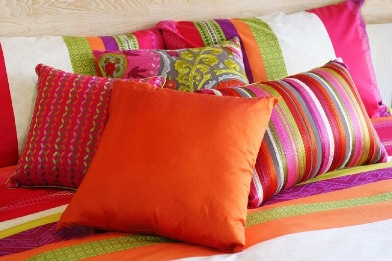Colorful Pillows on Bed