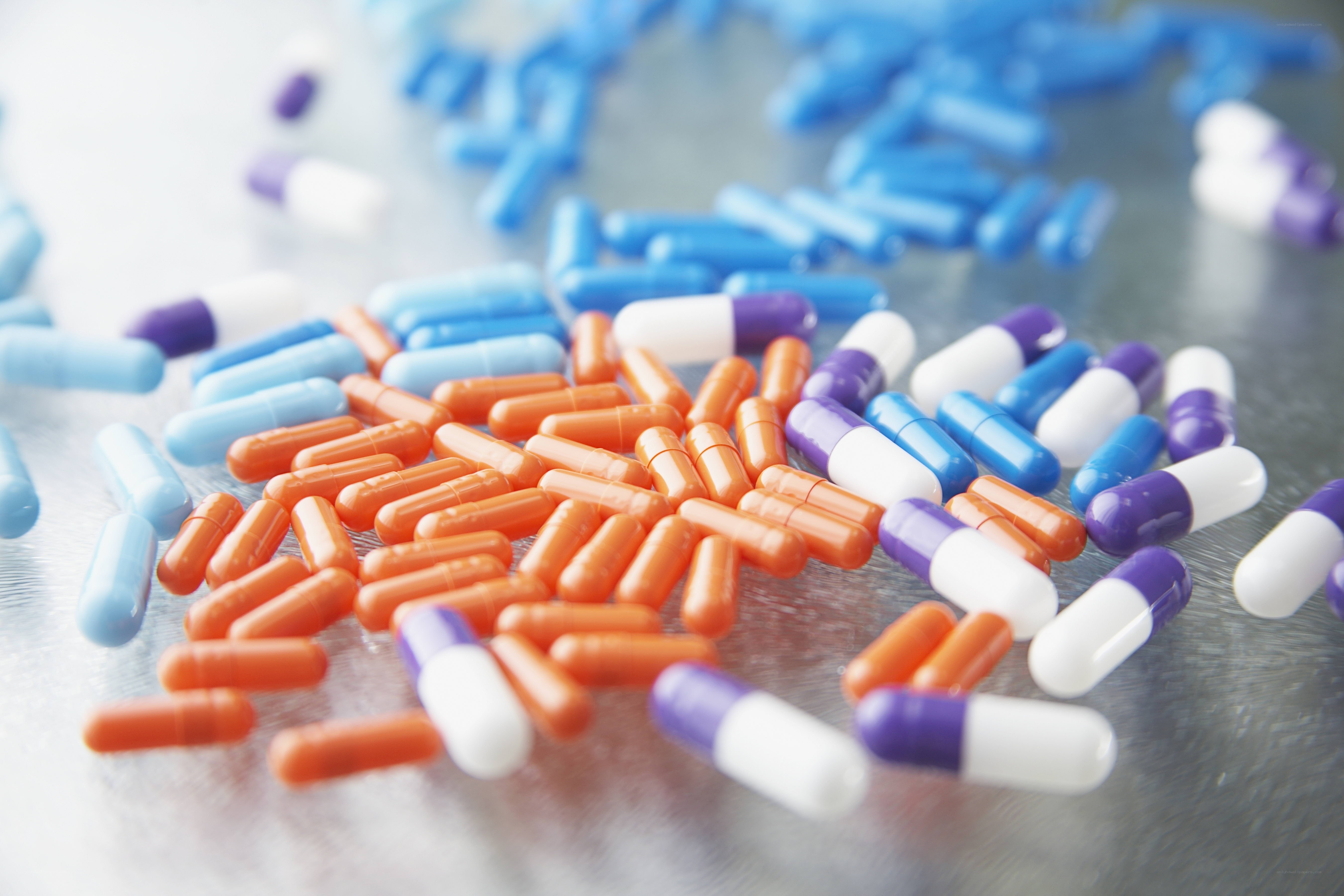 Colorful pills on a surface