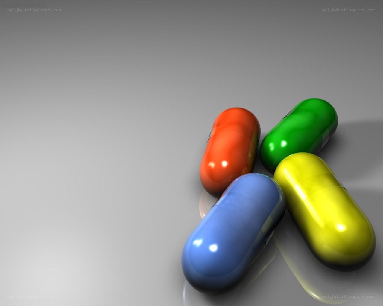 colorful pills on gray surface