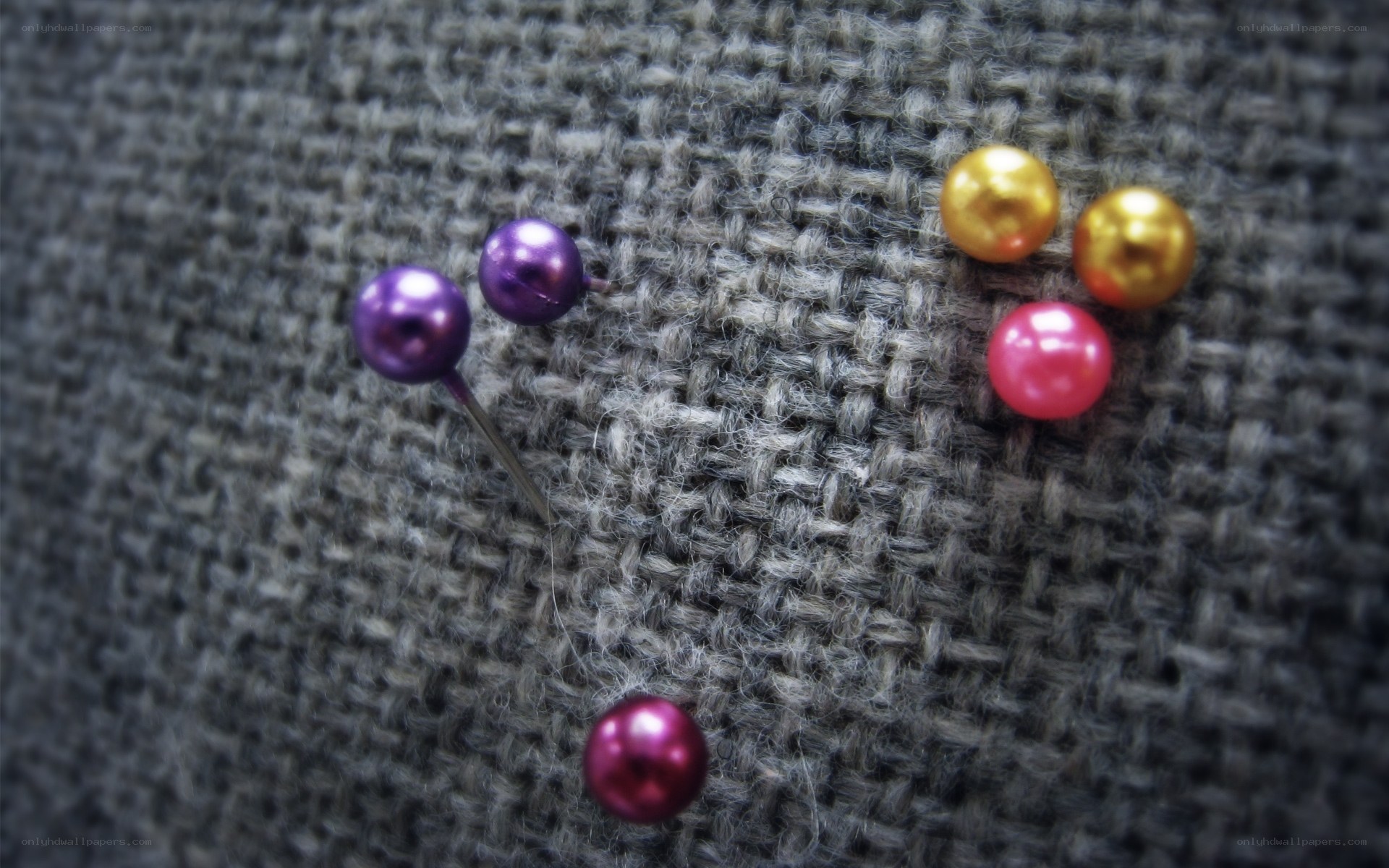 Colorful pins on fabric