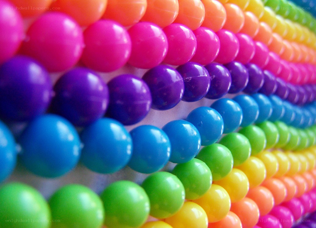Colorful plastic beads in rainbow