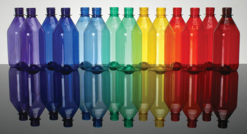 Colorful plastic bottles in rainbow order