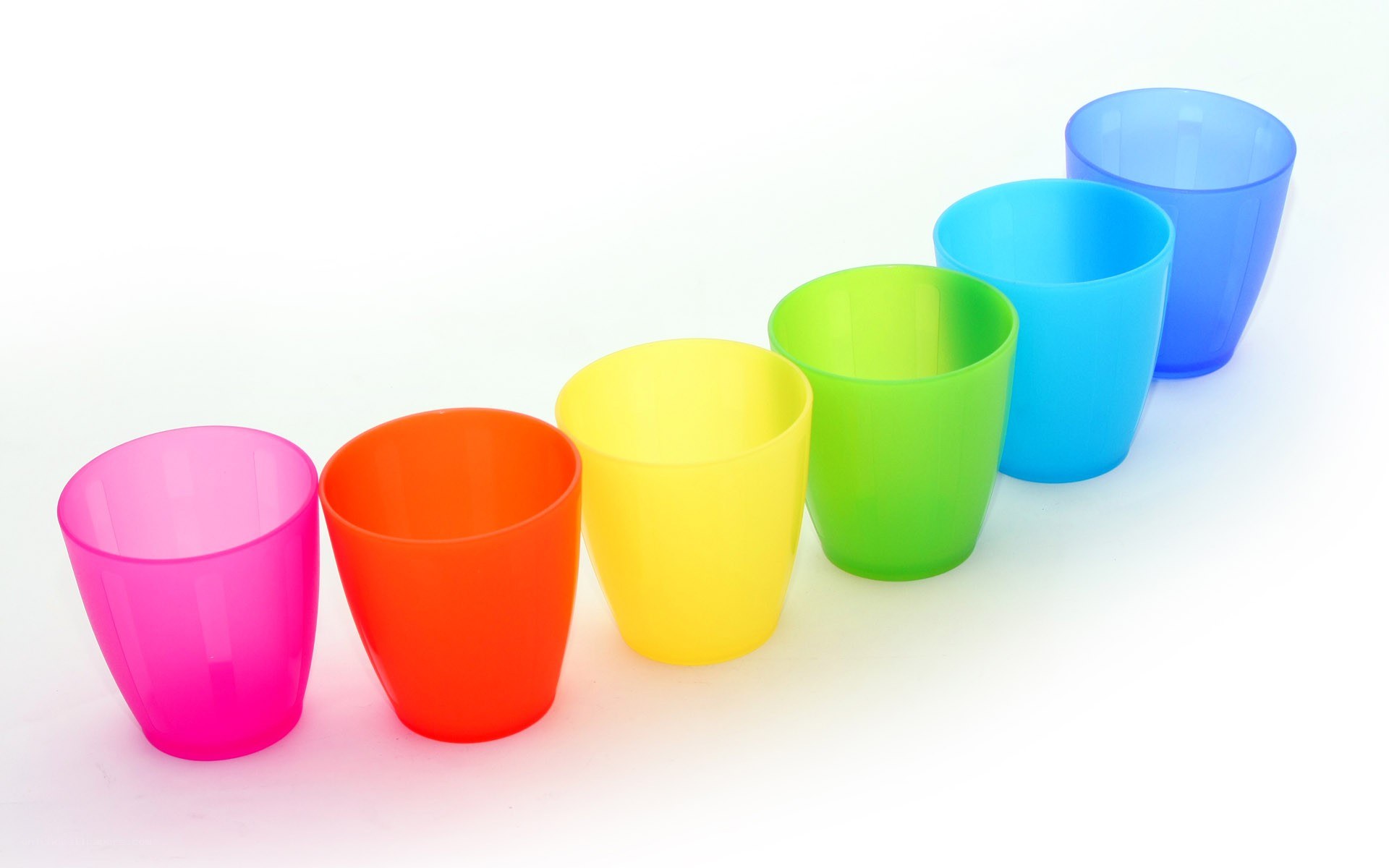 Colorful plastic cups in a row