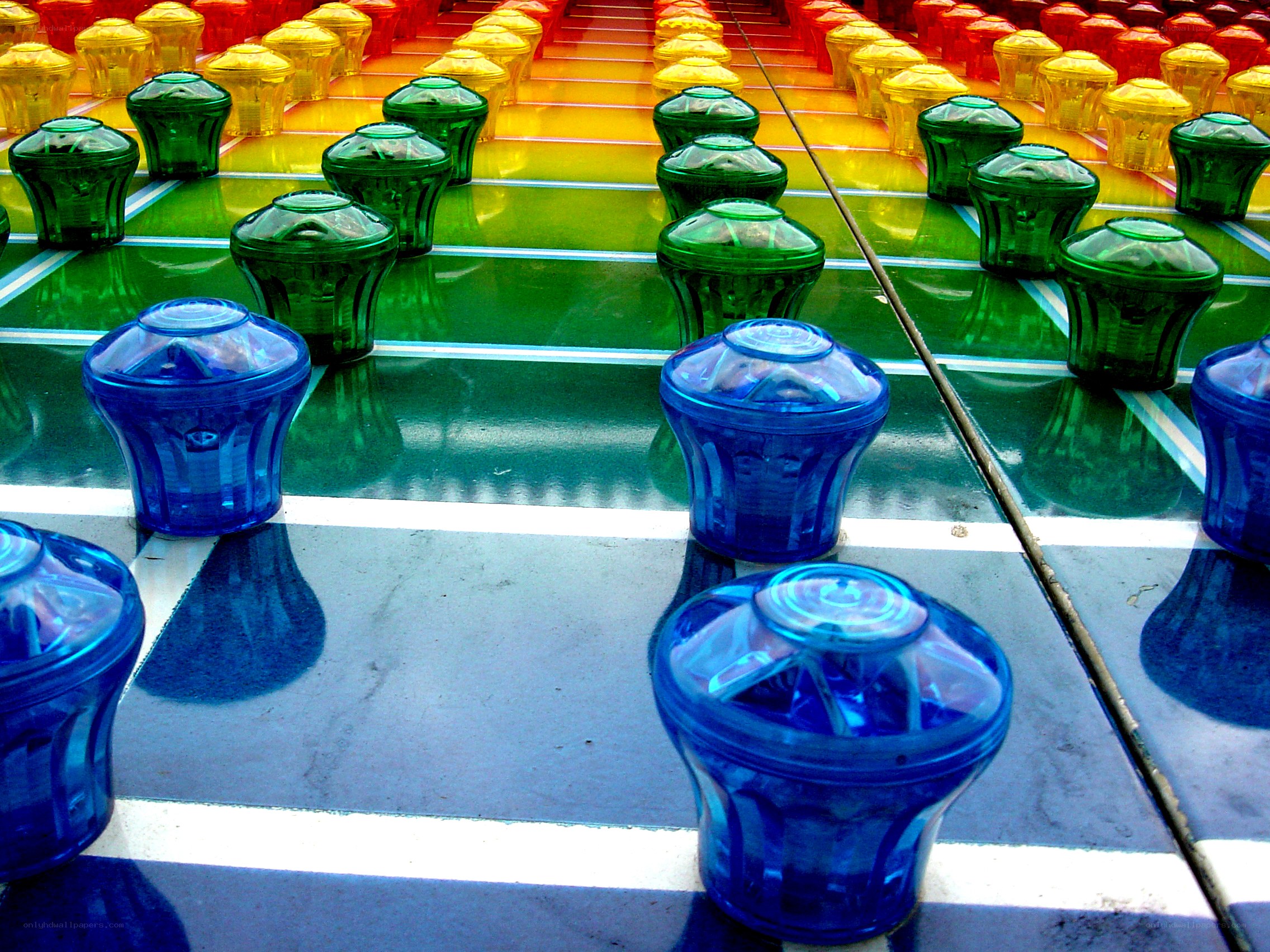 Colorful plastic game pieces on board