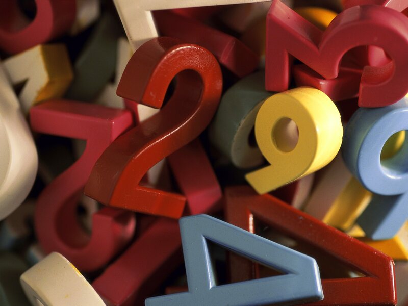 Colorful plastic numbers in a pile