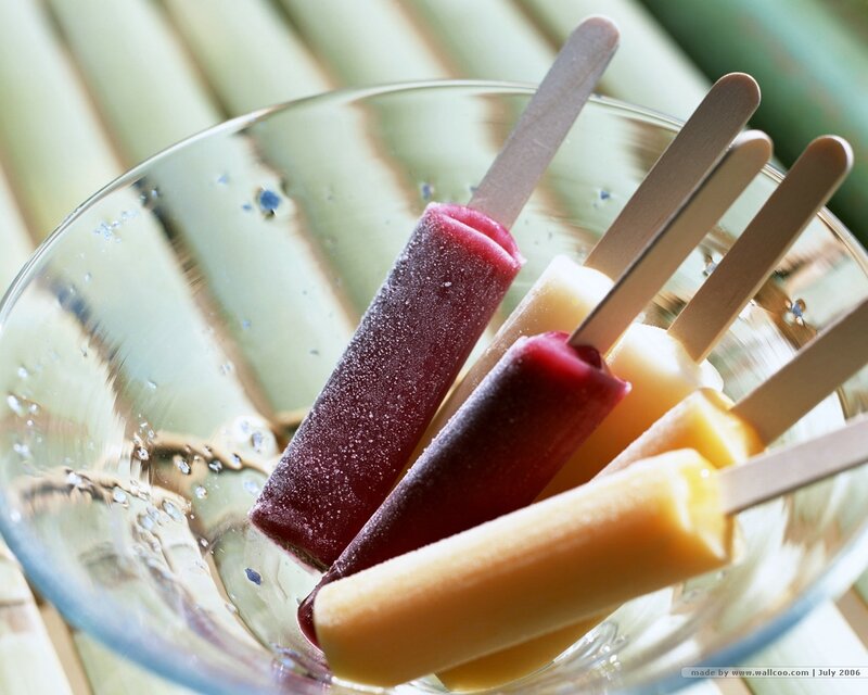 Colorful popsicles in a glass bowl