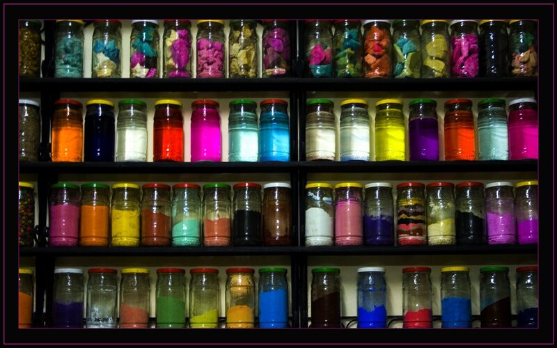 Colorful powders in glass jars