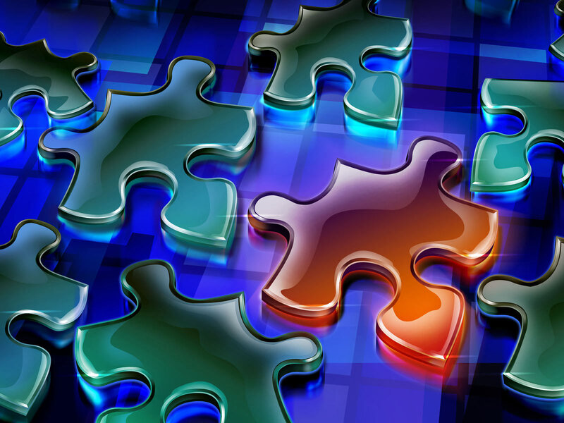 Colorful puzzle pieces on blue background