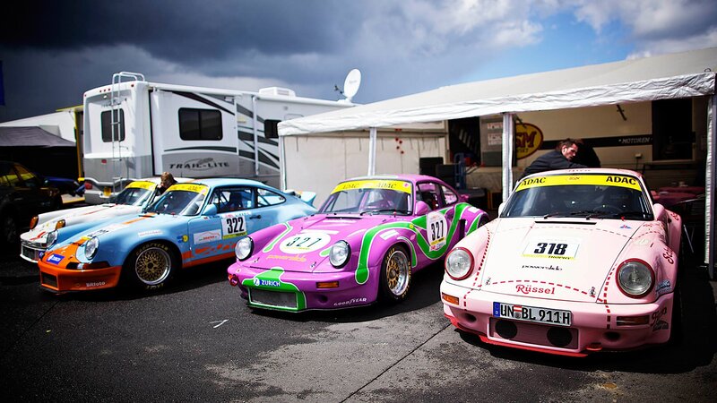Colorful race cars at a track