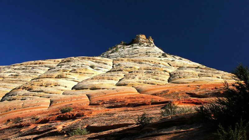 Colorful rock formation under blue sky