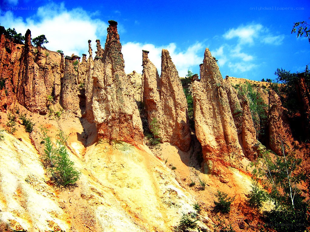 Colorful rock formations under blue sky
