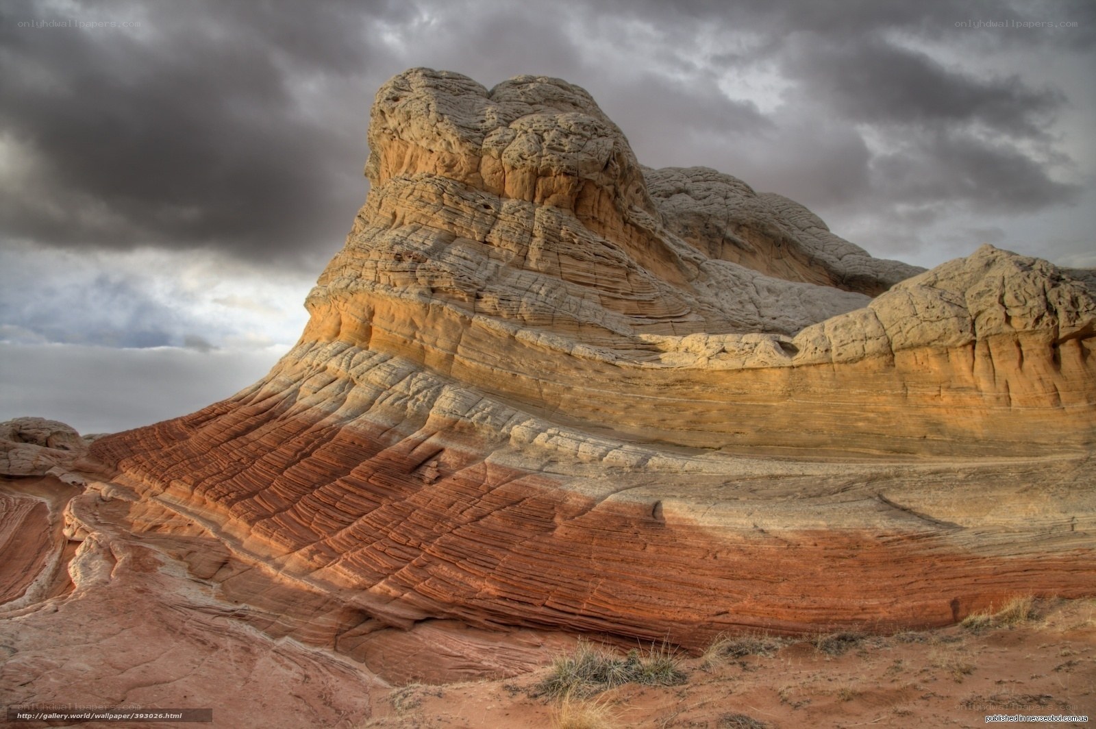 Colorful rock formations under stormy sky