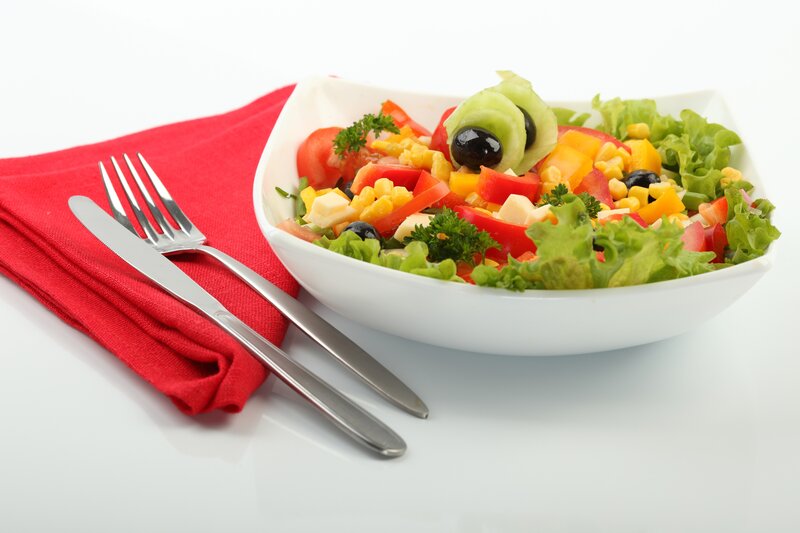 Colorful salad in a white bowl