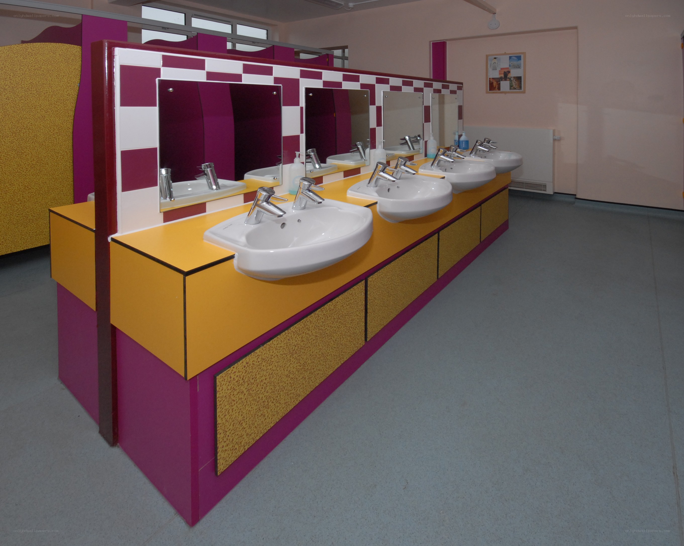 Colorful school bathroom sinks