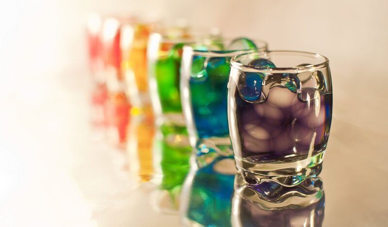 Colorful shot glasses in a row