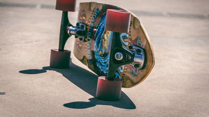Colorful Skateboard on Pavement