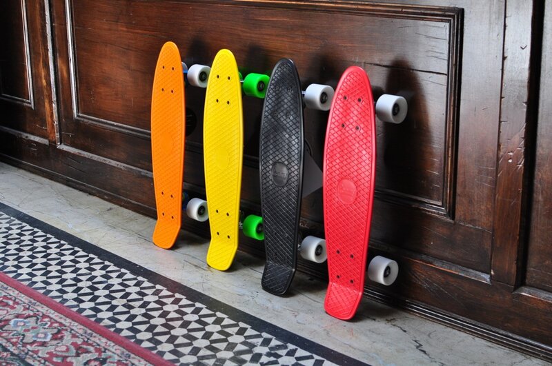 Colorful skateboards against wood