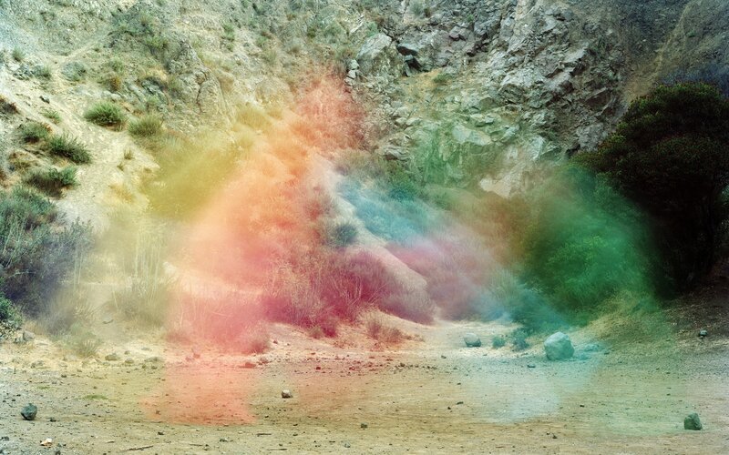 colorful smoke in a canyon