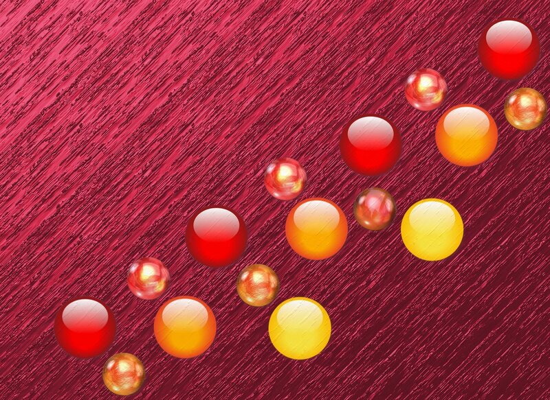 Colorful spheres on red background