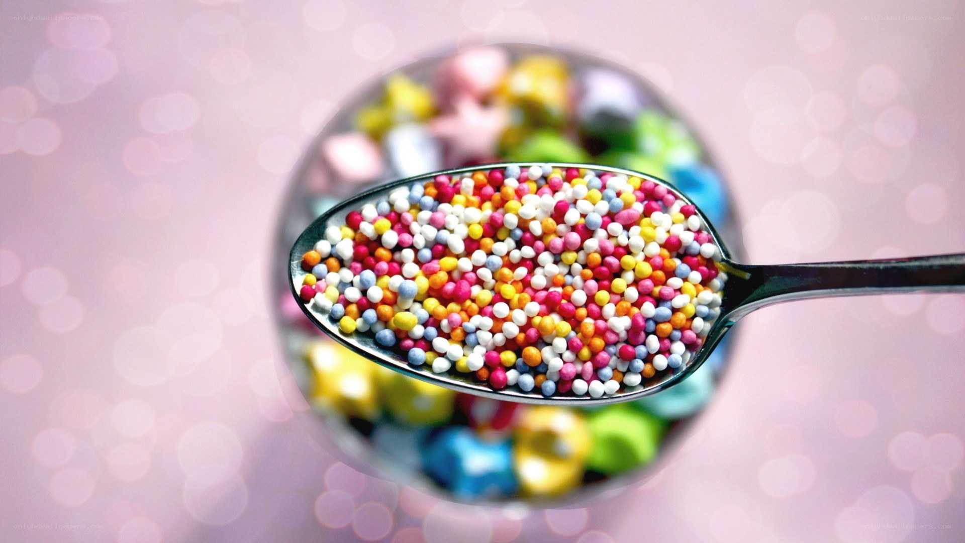 Colorful sprinkles on a spoon