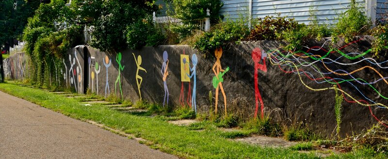 Colorful Stick Figures on Wall