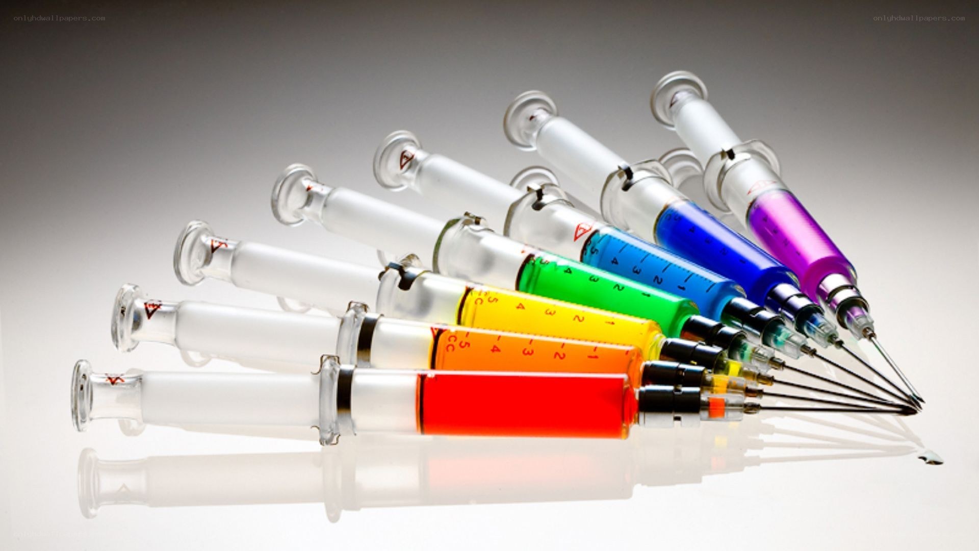Colorful syringes in a row