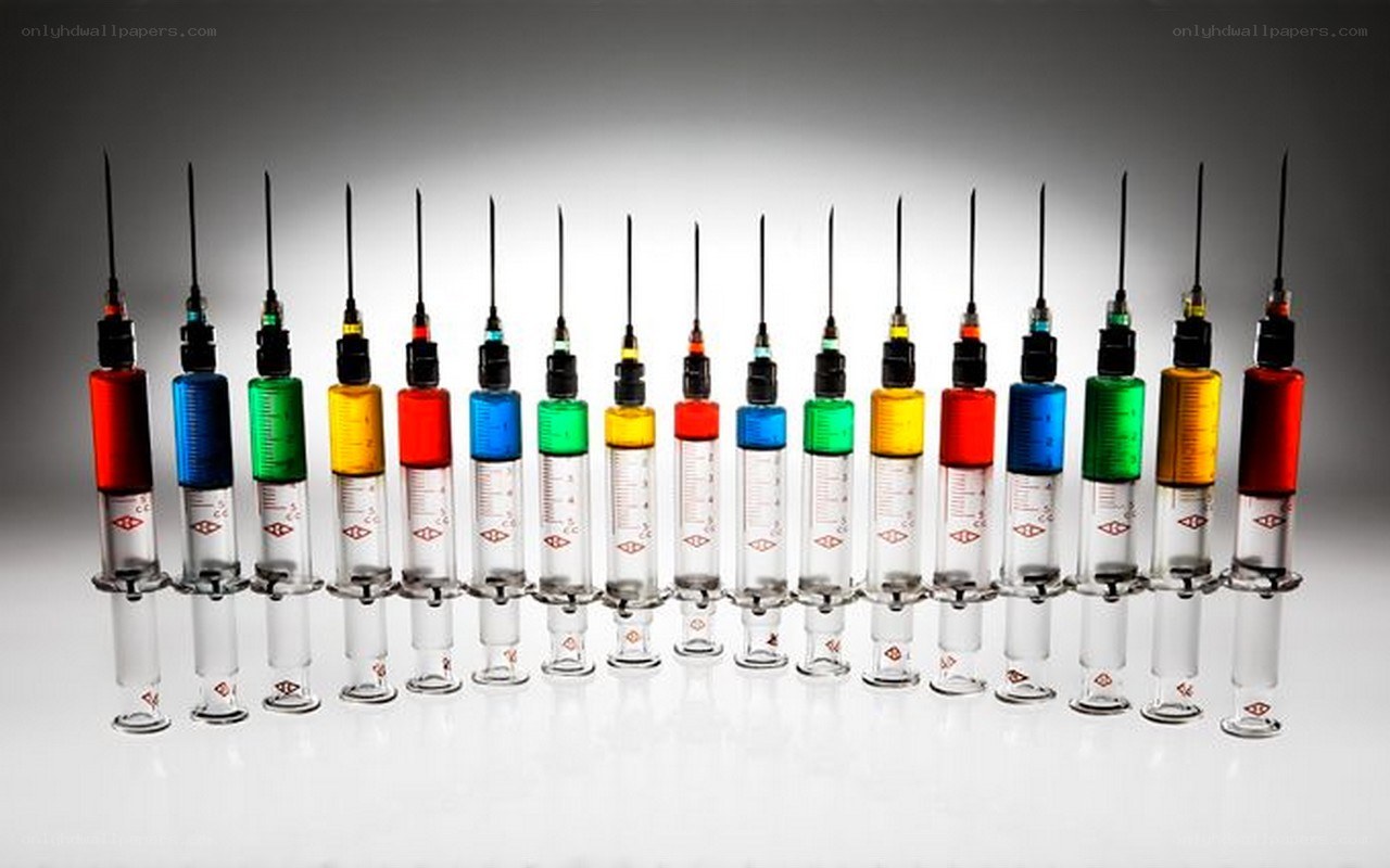 Colorful syringes in a row