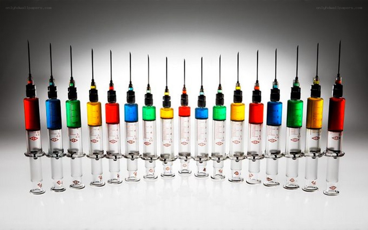 Colorful syringes in a row