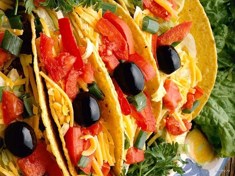 Colorful tacos with toppings