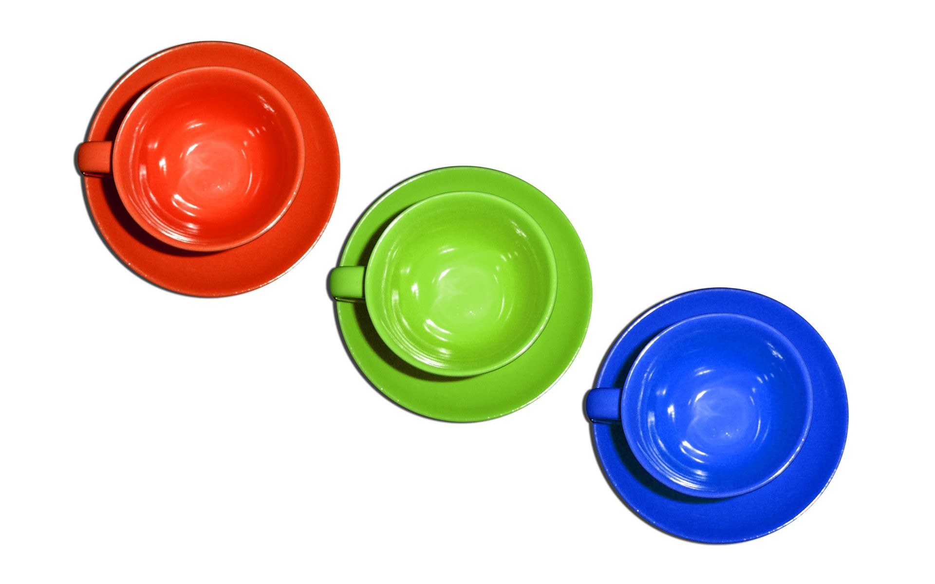 Colorful tea cups on saucers