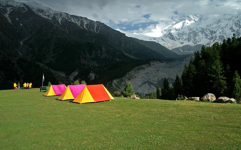 Colorful tents in mountain valley