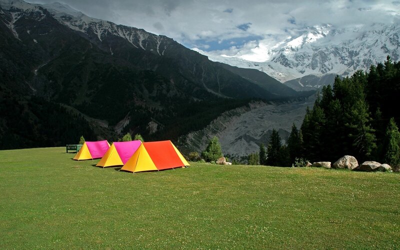 Colorful tents in mountain valley