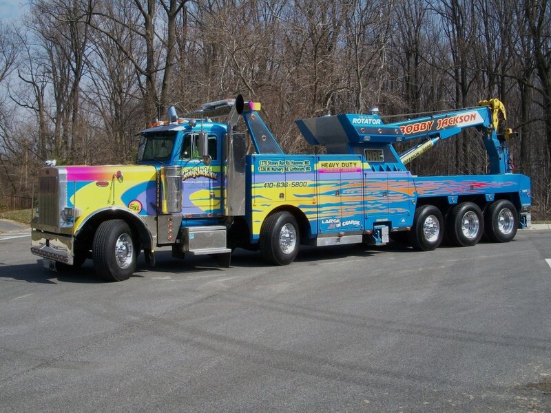 colorful tow truck with flame design