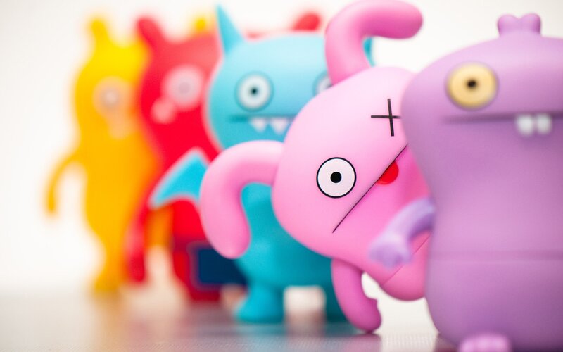 colorful toy figurines in a row