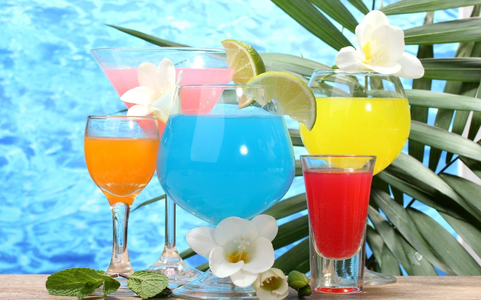 Colorful tropical drinks by pool