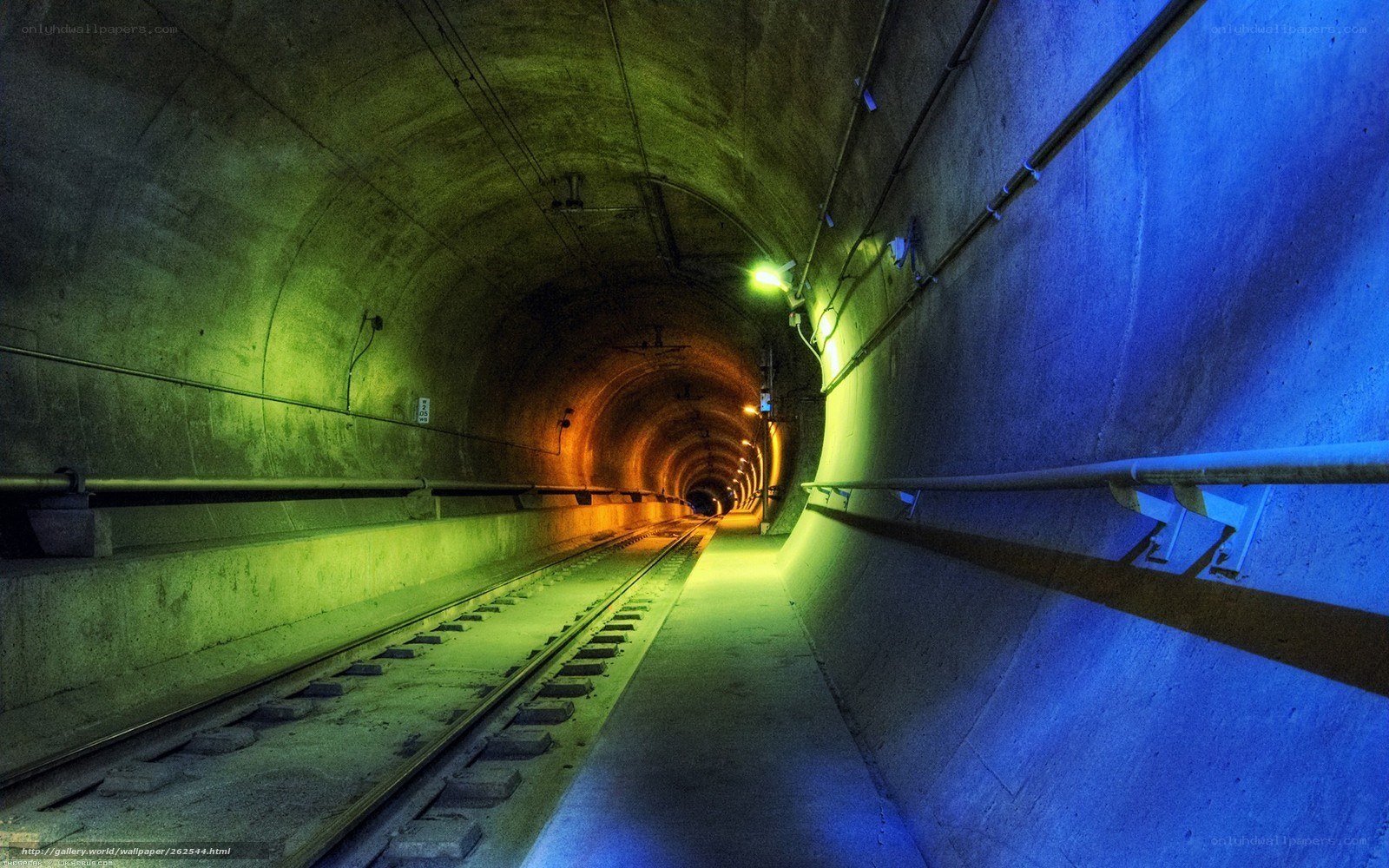 Colorful tunnel with train tracks
